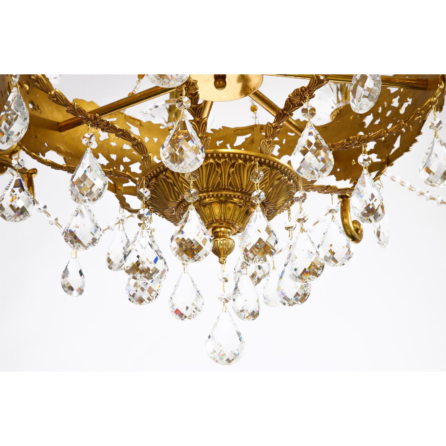 Eight Arm Chandelier with Large Crystal Prisms And Intricate Brass Patterns